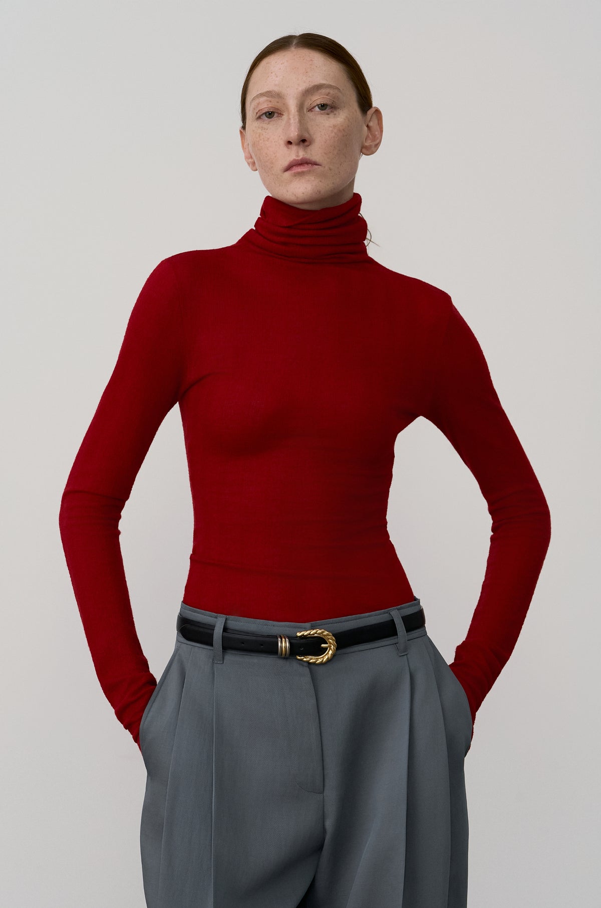 SUBTLE STRIPED WOOL JERSEY HIGH-NECK TOP